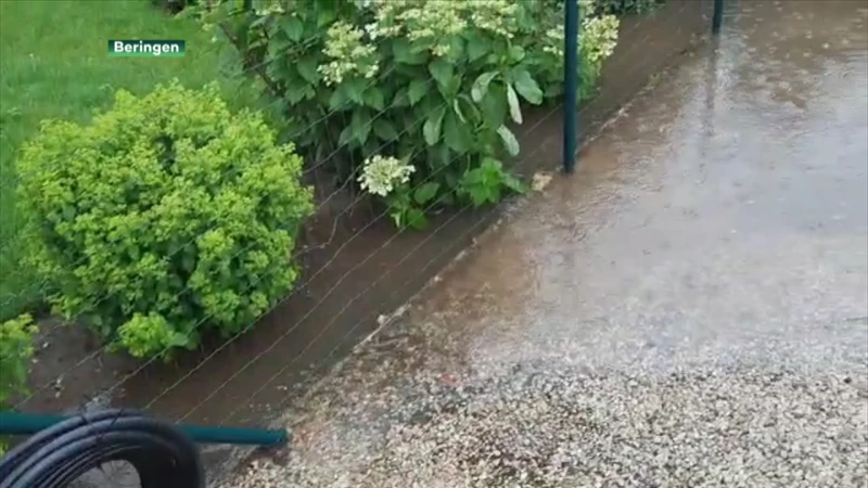 Stortvloed zet straat in Paal weer blank