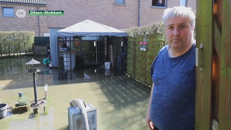 Huizen en tuinen ondergelopen in Dilsen-Stokkem door waterlek